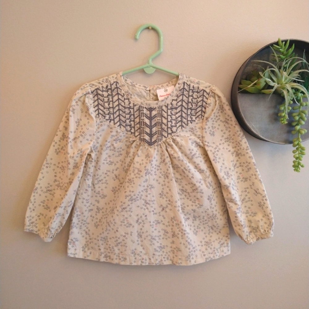 Hanna Andersson cream blouse with grey and red floral print w/ stitching detail